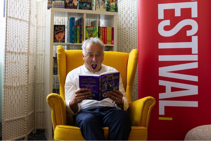 man reading book looking supplies
